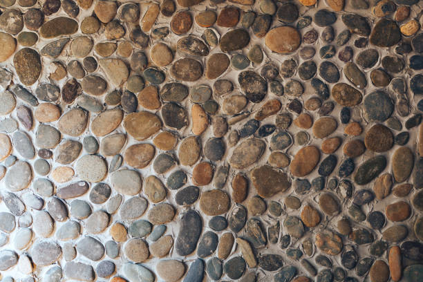 Background texture of different round stone wall
