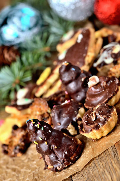 istock Christmas sweets with different types of candy on baking paper and Christmas decorations in background 1193990568