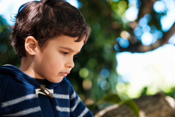 istock Cute boy outdoors 1193994015