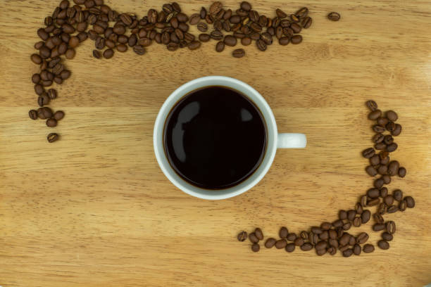 istock Wood, coffee cup and beans 1193995256