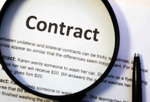 istock Pen and contract papers on wooden desk 1193998136