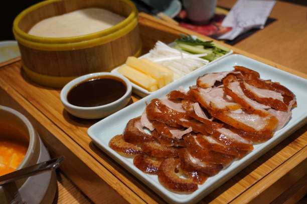 istock Peking duck wrapped with vegetables and fruit. 1194003364