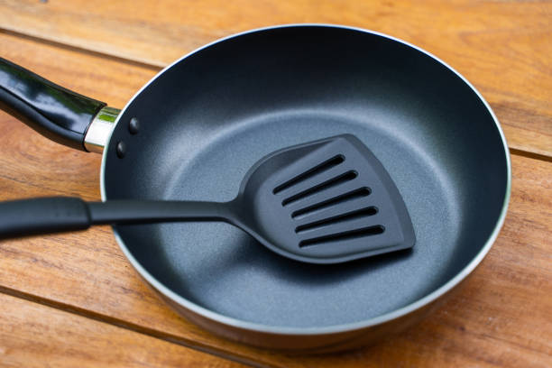 istock frying pan and flipper used in frying for cooking 1194013980