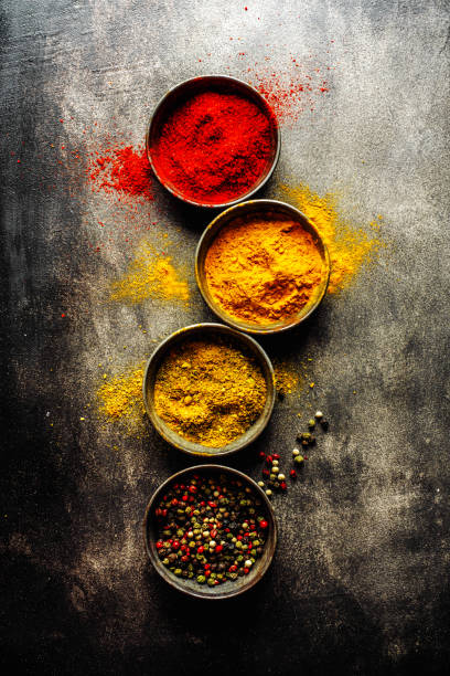istock Colorful spices on dark background 1194016787