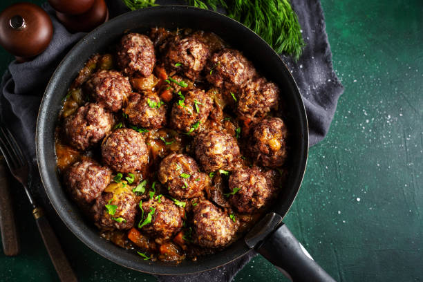 istock Fried meatballs with sauce on pan 1194016948