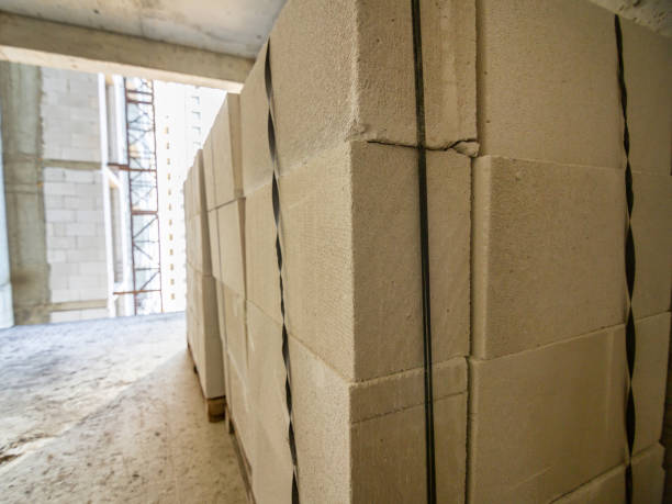 istock Packing aerated concrete blocks in a multi-storey building under construction 1194026228