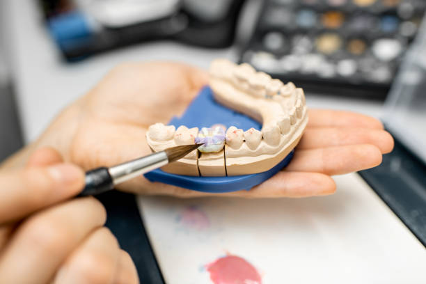 istock Dental technician coloring dental prosthesis 1194031112