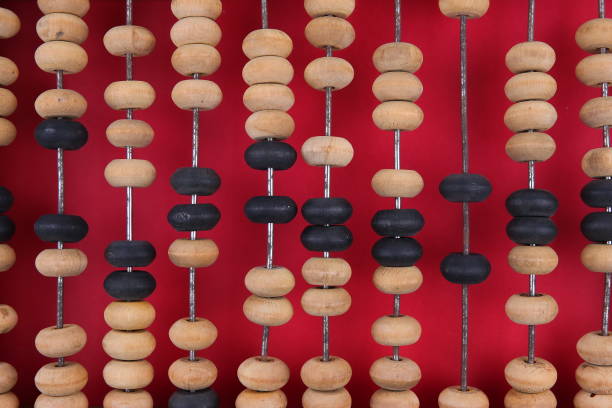 istock vintage wooden abacus on a red background. 1194033205