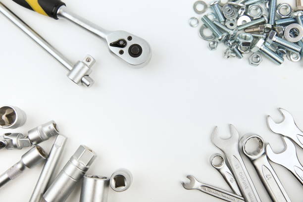istock different wrenches and heap of bolts and nuts on white background with copy space 1194033254
