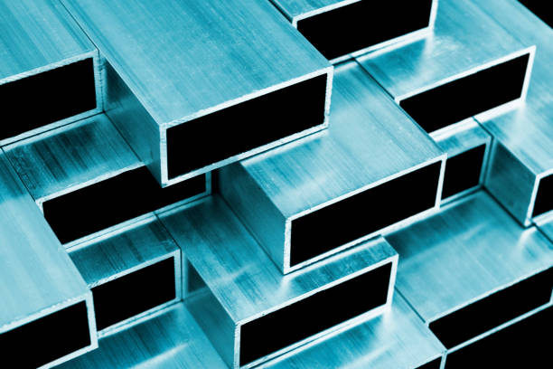 istock Aluminium profile for windows and doors manufacturing. Structural metal aluminium shapes. Aluminium profiles texture for constructions. Aluminium constructions factory background. 1194033255