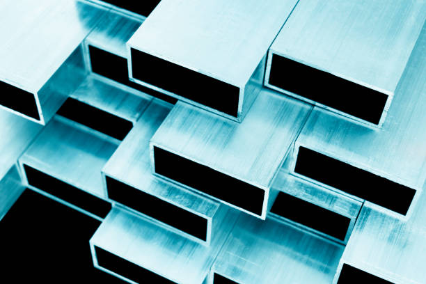 istock Aluminium profile for windows and doors manufacturing. Structural metal aluminium shapes. Aluminium profiles texture for constructions. Aluminium constructions factory background. 1194033438