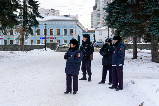 Perm, Russia - December 14, 2019: police officers keep order in a winter park \