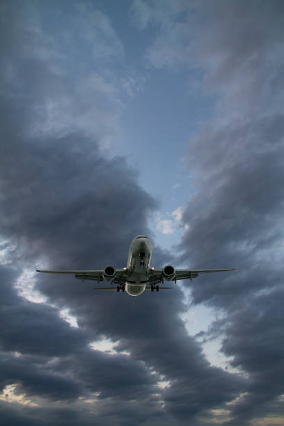 istock Jet airplane landing or taking off at dusk. 1194037123