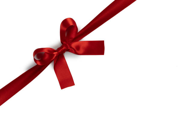 istock Red ribbon bow isolated on white 1194039958