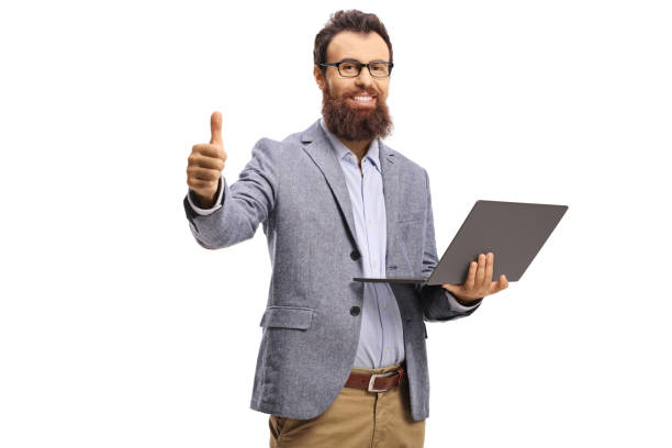 istock Smiling bearded man holding a laptop computer and showing thumbs up 1194045258