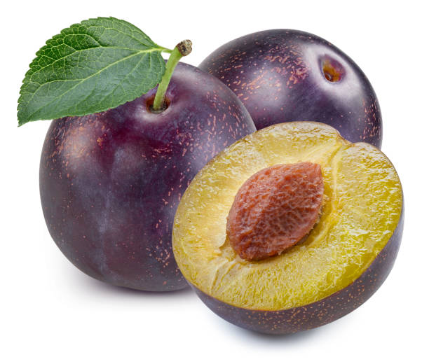 istock Plums half with leaves isolated 1194046767