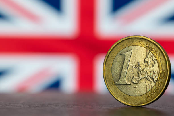 istock Euro coin against Britain flag, Brexit concept 1194047642
