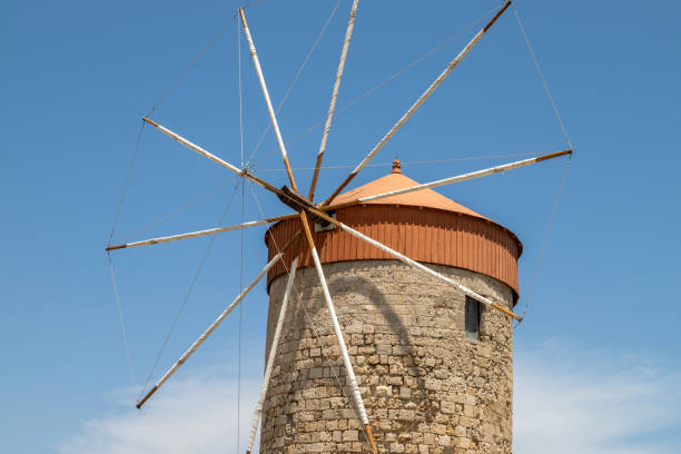 istock Old windmill at Mandraki  harbour in Rhodes city 1194050186