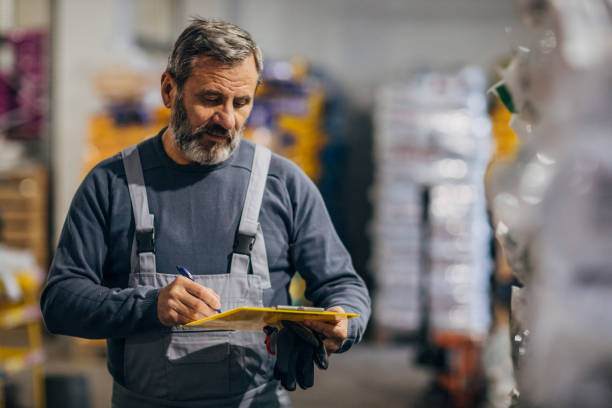 istock Senior man in big warehouse 1194055199