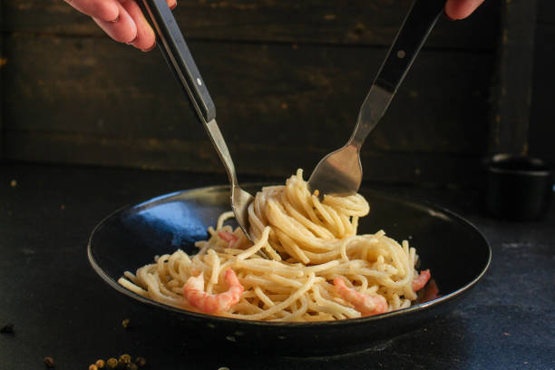 istock pasta shrimp (spaghetti cream sauce and seafood prawn) menu concept. food background. top view. copy space 1194056944