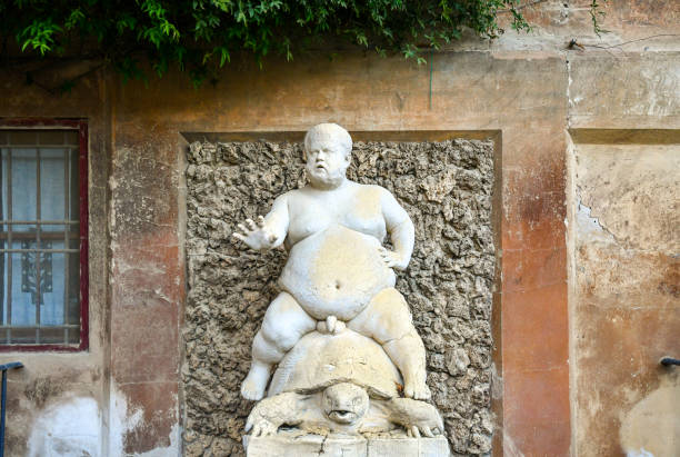 Detail of the Fountain of the Bacchino, depicting the most popular dwarf of the court of Cosimo I de' Medici, in the Boboli Gardens of Palazzo Pitti, Florence, Tuscany, Italy Florence, Tuscany / Italy - Oct 19 2019: The Fountain of the Bacchino in the Boboli Gardens of Palazzo Pitti, representing the obese dwarf Morgante, the most popular of the court dwarfs of Cosimo I de' Medici Cosimo stock pictures, royalty-free photos & images