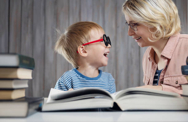 istock five years old child reading a book at home with mother 1194058323
