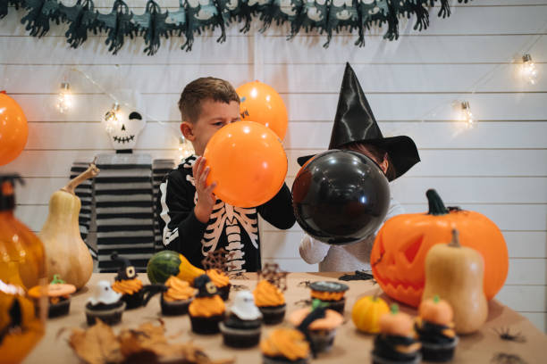 istock Siblings decorating during Halloween holiday 1194058367