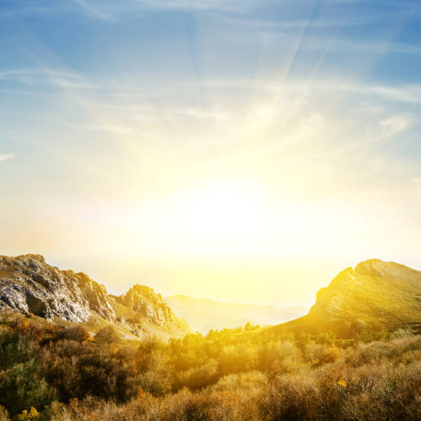 istock mountain valley in a rays of sun 1194060609