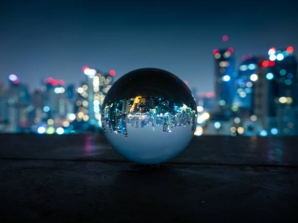 lensball sukhumvit view skyline of Bangkok through a glass ball bangkok city sunrise stock pictures, royalty-free photos & images