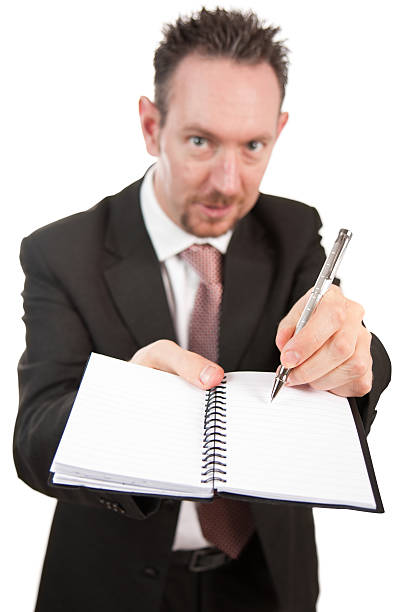 istock Aggressive Businessman with Notebook and Pen 119406908
