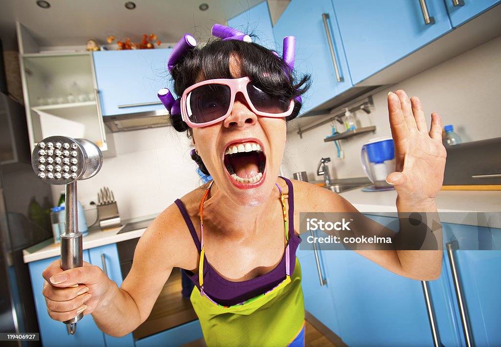 crazy housewife crazy housewife in an interior of the kitchen Adult Stock Photo