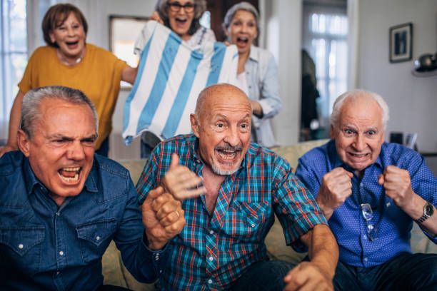istock Senior people watching sports match 1194070334