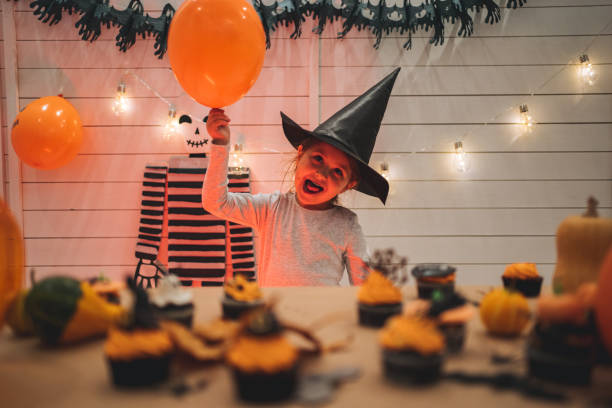 istock Cute girl role-playing as a witch during Halloween 1194072778