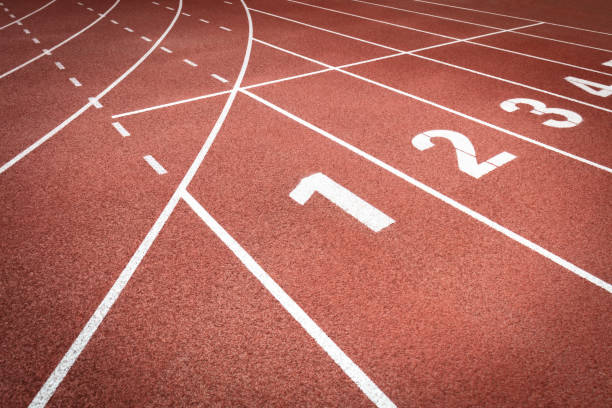 Close-up clean and refreshing red simple rubber runway without people Close-up clean and refreshing red simple rubber runway without people distance running stock pictures, royalty-free photos & images