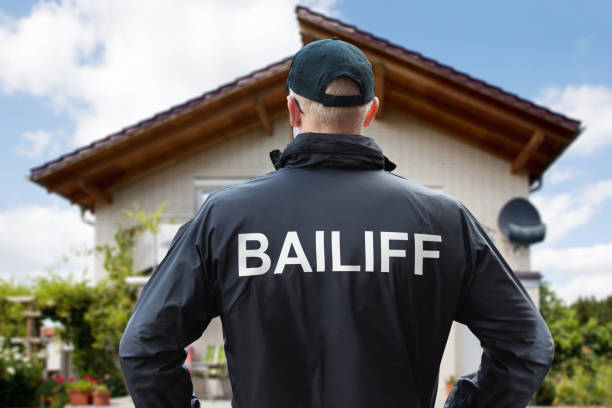 istock Security Guard Standing Outside The House 1194074541