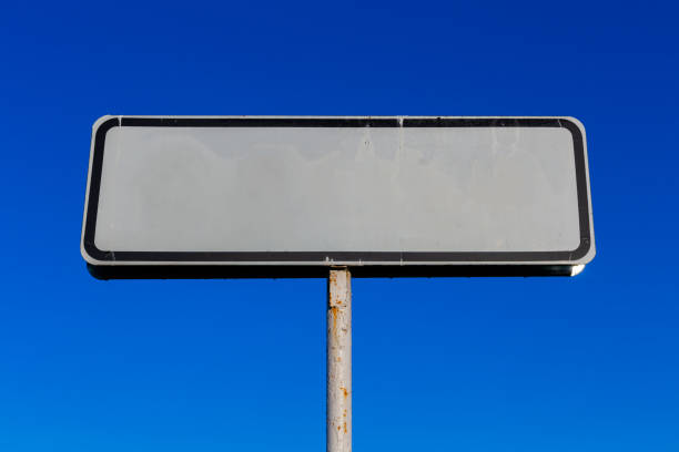 istock a small white road sign mockup on blue sky background 1194075652