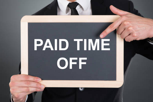 istock Businessman Pointing Work With Us Sign On Slate 1194075664
