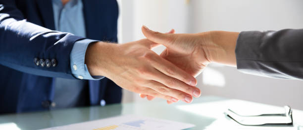 istock Businessman Shaking Hands With His Partner 1194075885