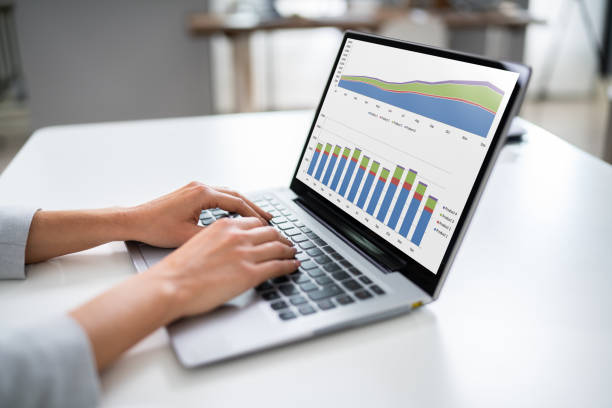 istock Businesswoman Analyzing Graph On Laptop 1194077000