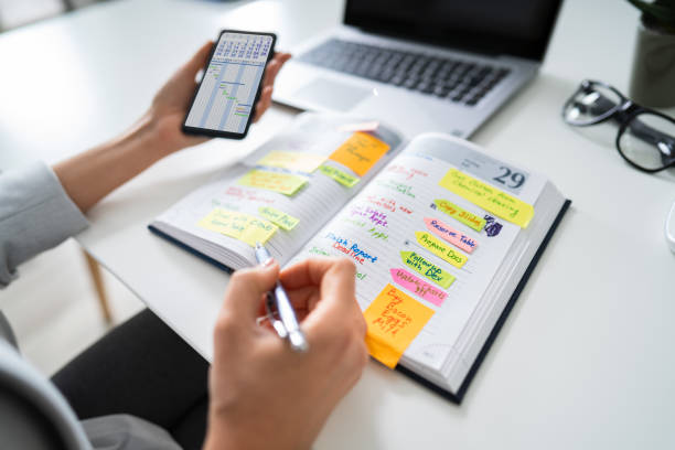 istock Businessperson Writing Schedule In Diary 1194077024