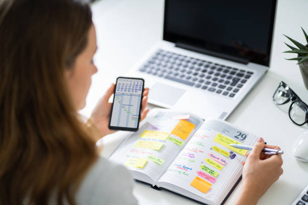 istock Businessperson Writing Schedule In Diary 1194077036