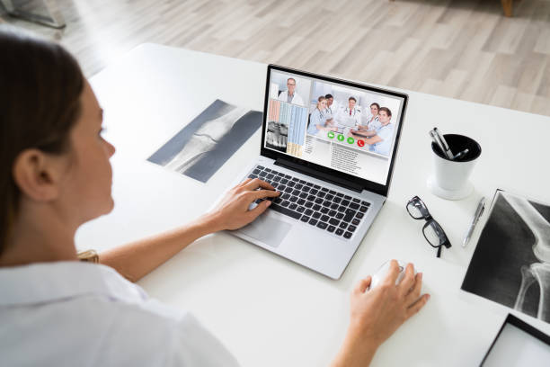 istock Female Doctor Video Chatting On Laptop 1194077241