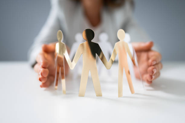 istock Person Protecting Paper Cut Out Figure 1194077276