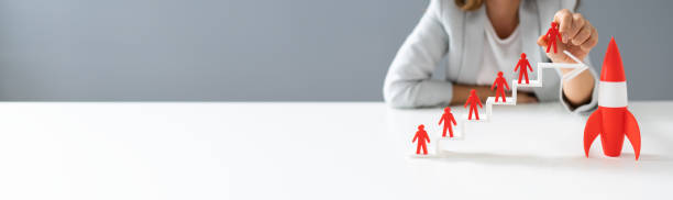 istock Red Rocket Beside Red Human Figure On Increasing Arrow 1194077311