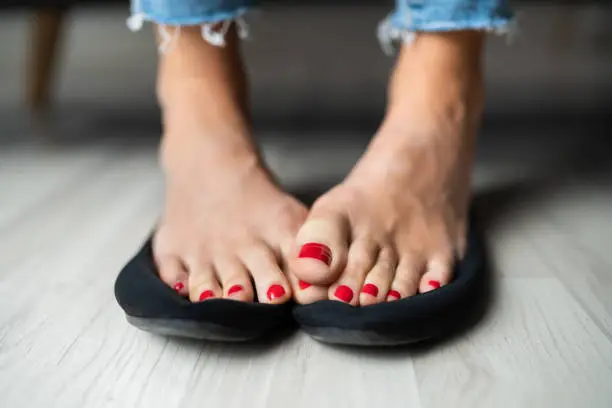 Photo of Woman Sweaty Feet On Shoes