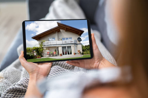 istock Young Woman Selecting New House 1194078560