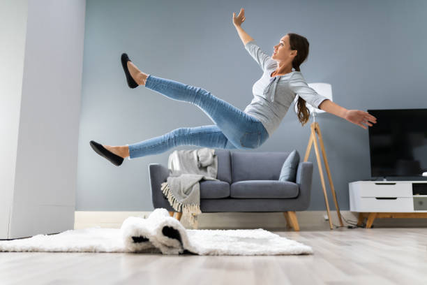 istock Woman Legs Stumbling With A Carpet 1194079647