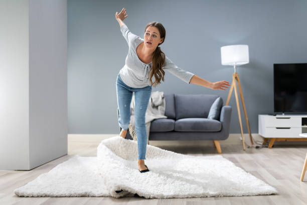 istock Woman Legs Stumbling With A Carpet 1194079648