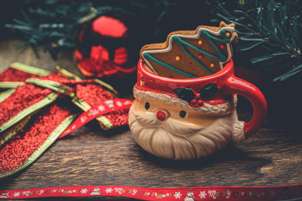 Santa Claus Coffee Cup And Christmas Decorations Stack Photos