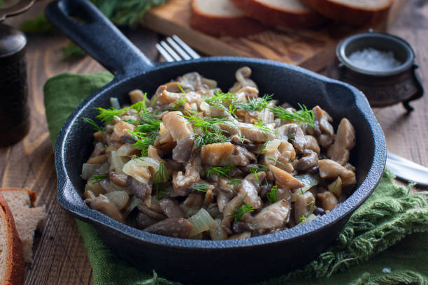 istock Fried oyster mushrooms in a cast-iron pan, selective focus 1194089790